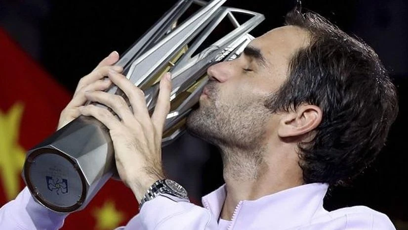 Roger Federer of Switzerland kisses his trophy after defeating Rafael Nadal of Spain in their men's singles final match to win the Shanghai Masters. Photo: AP/PTI Roger Federer of Switzerland kisses his trophy after defeating Rafael Nadal of Spain in their men's singles final match to win the Shanghai Masters. Photo: AP/PTI
