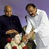 Chennai: Vice President M. Venkaih Naidu paying floral tributes to Didi Nirmala Deshpande at an event to rededicate Thakkar Bapa Vidyalaya, in Chennai on Tuesday. Governor of Tamil Nadu, Banwarilal Purohit and the Minister for Fisheries, Personnel an
