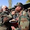 Prime Minister Narendra Modi offers sweets to jawans on the occasion of Diwali, at Gurez Valley , Jammu and Kashmir. Photo: PTI