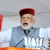 Prime Minister Narendra Modi waves at crowd during BJP Parivartan Rally at Rait near Dharamsala. (Photo: PTI)