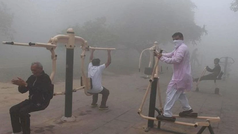 People seen doing excercise at a public park People seen doing excercise at a public park
