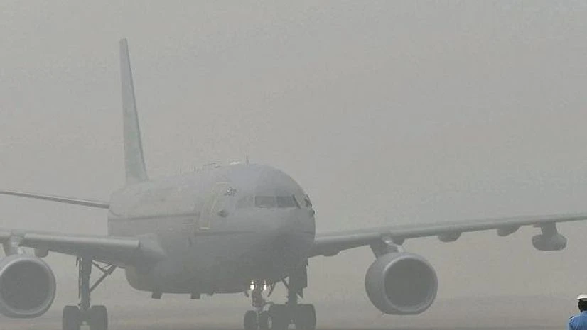 The plane of Britain's Prince Charles in surrounded by smog at Air Force Station Palam in New Delhi on Wednesday. Photo: PTI The plane of Britain's Prince Charles in surrounded by smog at Air Force Station Palam in New Delhi on Wednesday. Photo: PTI