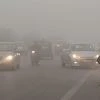 Vehicles drive through heavy smog near Akshardham Metro Station in New Delhi on Wednesday. Photo: PTI