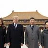 President Donald Trump, second left, first lady Melania Trump, left,  Chinese President Xi Jinping, second right, and his wife Peng Liyuan, right, stand together as they tour the Forbidden City. Photo: AP/PTI