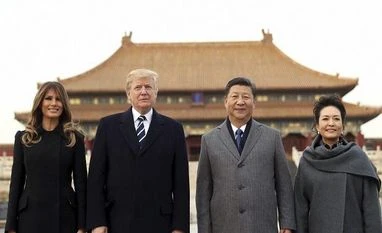 Donald Trump's China visit: US President talks to Xi over N Korea, trade President Donald Trump, second left, first lady Melania Trump, left, Chinese President Xi Jinping, second right, and his wife Peng Liyuan, right, stand together as they tour the Forbidden City. Photo: AP/PTI