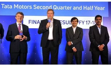 Tata Motors Q2 net profit jumps three-fold to Rs 2,500 crore on JLR sales (From left) Ralf Speth, Global CEO, Jaguar Land Rover; Guenter Butschek, CEO & MD, Tata Motors; Mayank Pareek, president for passenger vehicles, Tata Motors and Girish Wagh, head, commercial vehicles, Tata Motors, in Mumbai on Thursday.