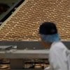 A worker inspects biscuits on the production line of Pladis' McVities factory in London Britain. Photo: Reuters