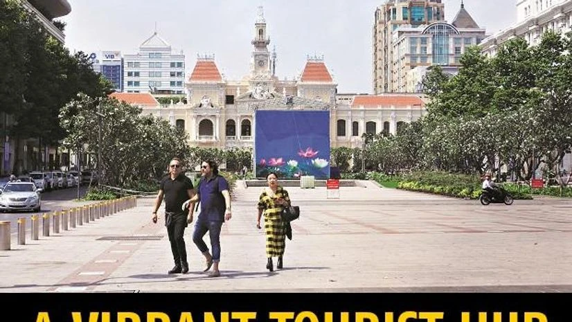 The Nguyen Hue Street with the city hall in the distance. The Nguyen Hue Street with the city hall in the distance.