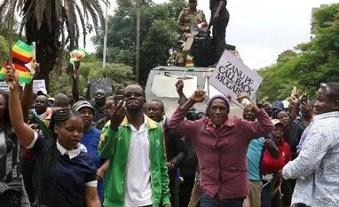 Why a Mnangagwa presidency would not be a new beginning for Zimbabwe Protesters calling for Zimbabwean President Robert Mugabe to step down take to the streets in Harare, Zimbabwe. (Photo: Reuters)