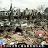 Ningbo : In this image from video run by China's CCTV, firefighters and people, right, walk near damaged buildings and vehicles following an explosion in Ningbo in east China's Zhejiang province. (Photo: AP/PTI)