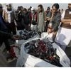 Islamabad : Supporters of a radical religious party, Tehreek-i-Labaik Ya Rasool Allah, gather around a pile of empty tear gas canisters and rubble bullets fired by police during clash, in Islamabad, Pakistan. (Photo: AP/PTI)