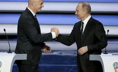 FIFA World Cup 2018: Infantino tells Putin world is 'in love' with Russia FIFA president Gianni Infantino, left, and Russian President Vladimir Putin shakes hands at the 2018 soccer World Cup draw in the Kremlin in Moscow, Friday, Dec. 1, 2017. AP/PTI