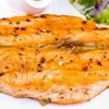 Grilled salmon steak on white plate
