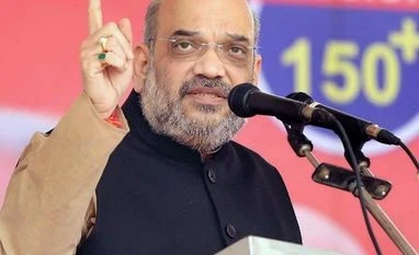 Amit Shah votes; asks people to continue Gujarat's 'vikas yatra' Amit Shah