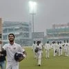Sri Lanka's Dinesh Chandimal gestures with his bat as he walks off the field after end of the play on Day 3 of the third cricket test match, at Ferozshah Kotla in New Delhi