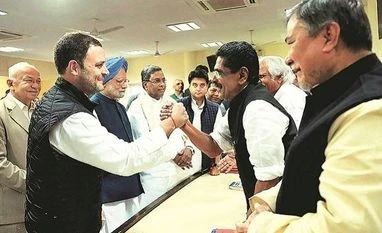 Rahul Gandhi all set to become Congress president (From left) Congress Vice-President Rahul Gandhi and Former Prime Minister Manmohan Singh with party colleagues at the AICC office in Delhi on Monday