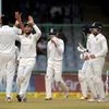 India's Ravichandran Ashwin (L) celebrates the wicket of Sri Lanka's Dinesh Chandimal during the fifth day of third cricket test match, at Ferozshah Kotla. Photo: PTI