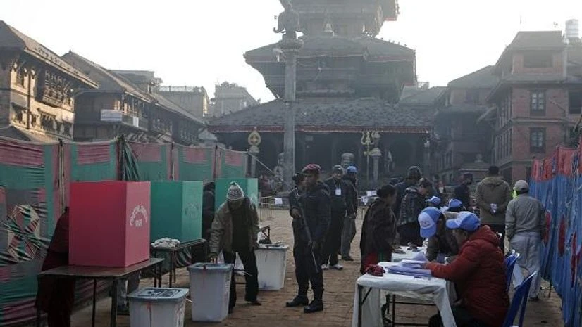Nepalese people cast their vote during the legislative elections in Bhaktapur. Photo: AP/PTI Nepalese people cast their vote during the legislative elections in Bhaktapur. Photo: AP/PTI