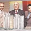 File photo of Unitech Chairman Ramesh Chandra (centre) with Managing Directors  Ajay Chandra (left) and Sanjay Chandra