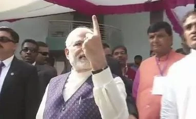 Gujarat polls: Amid 'Modi Modi' chants, PM queues up to vote in Ahmedabad Modi, Gujpoll