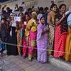 Woman voters wait in a long queue to cast their votes for the second phase of assembly elections at Raipur, Ahmedabad. Photo: PTI