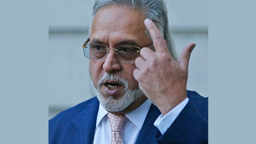 F1 Force India team boss Vijay Mallya waits outside Westminster Magistrates Court in London F1 Force India team boss Vijay Mallya waits outside Westminster Magistrates Court in London