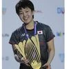 Akane Yamaguchi poses with the trophy after she beat India's Pusarla V. Sindhu in the final match of the Dubai Badminton World Superseries Finals in Dubai