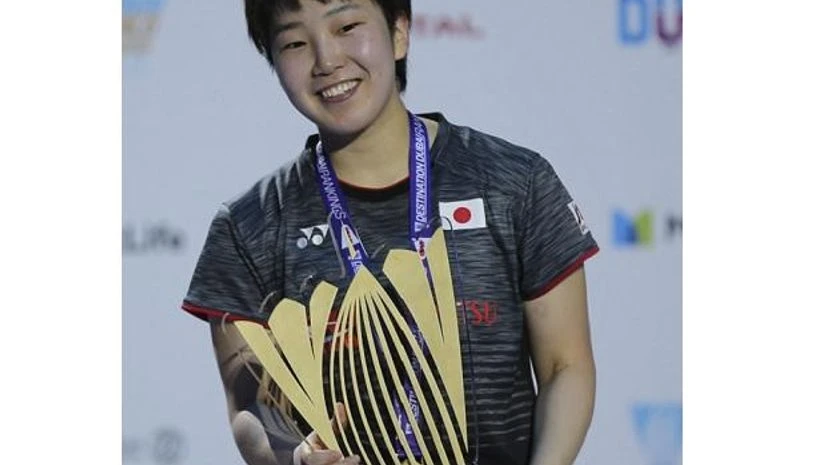Akane Yamaguchi poses with the trophy after she beat India's Pusarla V. Sindhu in the final match of the Dubai Badminton World Superseries Finals in Dubai Akane Yamaguchi poses with the trophy after she beat India's Pusarla V. Sindhu in the final match of the Dubai Badminton World Superseries Finals in Dubai