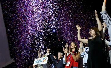 Billionaire Pinera easily wins Chile election Former President Sebastian Pinera waves to supporters under a shower of confetti as he celebrates winning the presidential election runoff in Santiago. Photo: AP/PTI Photo