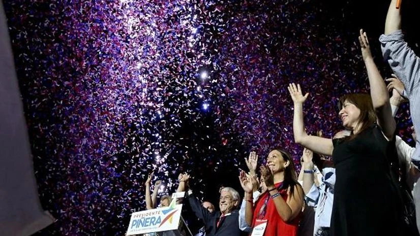 Former President Sebastian Pinera waves to supporters under a shower of confetti as he celebrates winning the presidential election runoff in Santiago. Photo: AP/PTI Photo Former President Sebastian Pinera waves to supporters under a shower of confetti as he celebrates winning the presidential election runoff in Santiago. Photo: AP/PTI Photo