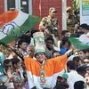Congress party supporters celebrate after a party candidate's win in the Assembly elections, outside the Gujarat College counting centre in Amedabad on Monday