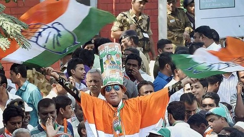 Congress party supporters celebrate after a party candidate's win in the Assembly elections, outside the Gujarat College counting centre in Amedabad on Monday Congress party supporters celebrate after a party candidate's win in the Assembly elections, outside the Gujarat College counting centre in Amedabad on Monday