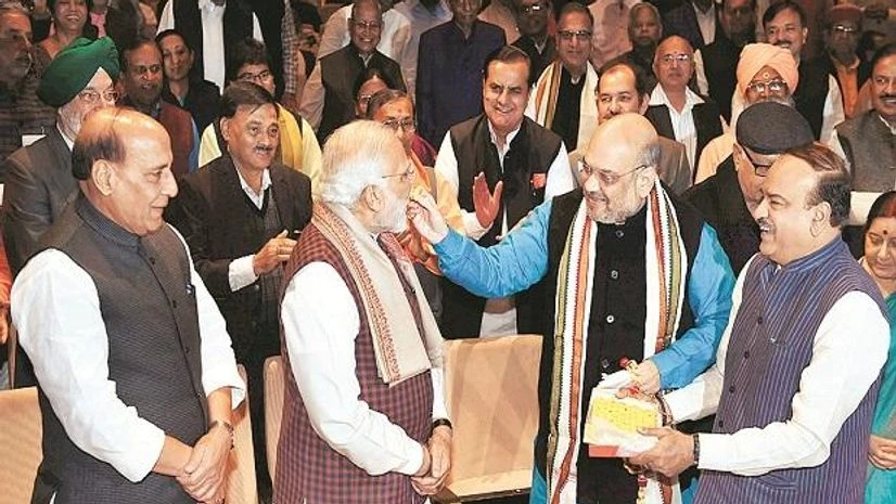 Prime Minister Narendra Modi and BJP President Amit Shah celebrate the party’s success in Gujarat and Himachal Pradesh Assembly elections, during the Parliamentary board meeting in New Delhi on Wednesday. Photo: pti Prime Minister Narendra Modi and BJP President Amit Shah celebrate the party’s success in Gujarat and Himachal Pradesh Assembly elections, during the Parliamentary board meeting in New Delhi on Wednesday. Photo: pti