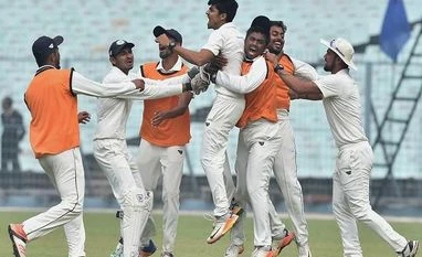 A Ranji first: DRS to be used in semifinal between Saurashtra and Gujarat Vidarbha bowler RN Gurbani celebrates with the teammates after dismissing Karnataka batsman A Aravind during the 2nd semi-final match of Ranji Trophy cricket match, in Kolkata. File Photo: PTI