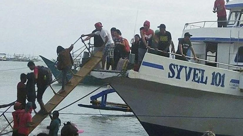 Rescued passengers from the ill-fated M/V Mercraft 3 disembark from a boat which helped in the rescue operation at Infanta township, Quezon province in northeastern Philippines. Photo: AP | PTIRescued passengers from the ill-fated M/V Mercraft 3 dise Rescued passengers from the ill-fated M/V Mercraft 3 disembark from a boat which helped in the rescue operation at Infanta township, Quezon province in northeastern Philippines. Photo: AP | PTI