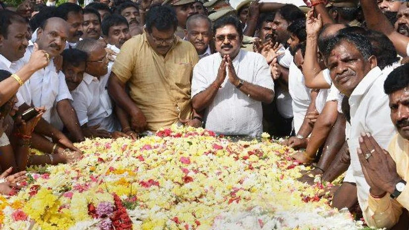 Sidelined AIADMK leader T T V Dhinakaran offering floral tributes at the memorial of MG Ramachandran after winning the RK Nagar constituency bypoll, at Marina in Chennai (Photo: PTI) Sidelined AIADMK leader T T V Dhinakaran offering floral tributes at the memorial of MG Ramachandran after winning the RK Nagar constituency bypoll, at Marina in Chennai (Photo: PTI)