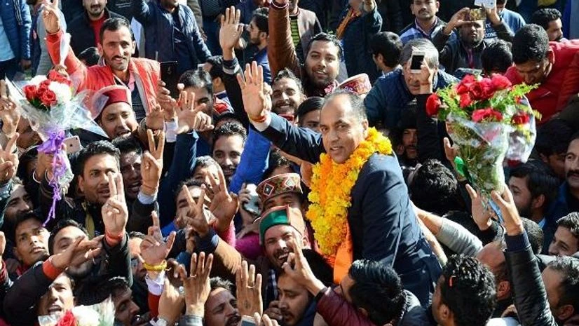 BJP's Jairam Thakur celebrates along with supporter after he was chosen as the party's Legislature party leader at a meeting, in Shimla. Photo: PTI BJP's Jairam Thakur celebrates along with supporter after he was chosen as the party's Legislature party leader at a meeting, in Shimla. Photo: PTI