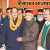 Former chief minister P K Dhumal (right) congratulates Jairam Thakur after the latter was chosen as the BJP’s  legislature party leader, at a meeting in Shimla. Photo: PTI