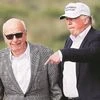 President Donald Trump speaks to media mogul Rupert Murdoch as they walk out of Trump International Golf Links in Aberdeen, Scotland on June 25, 2016. Photo: Reuters