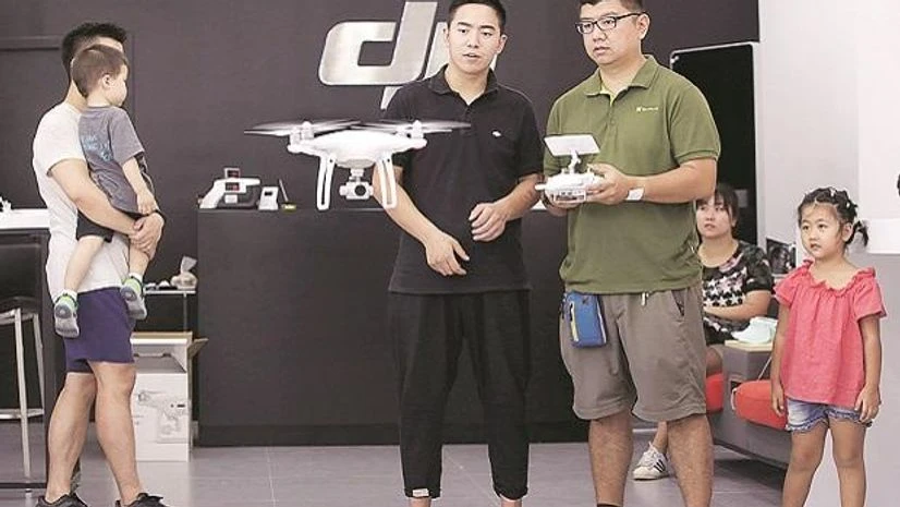 drone A customer tests a drone at a shop in Beijing