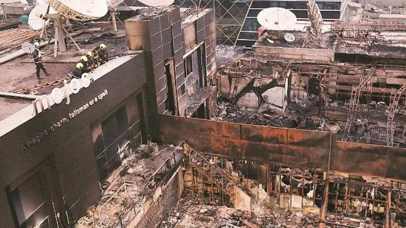 Mumbai fire Fire fighters inspect the remains of the restaurants destroyed in a fire in Mumbai on Thursday Photo: Reuters