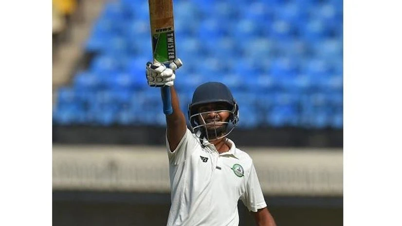 Vidarbha batsman Akshay Wadkar celebrates his half century during the 3rd day of the Ranji Trophy final cricket match against Delhi, in Indore. Photo: PTI Vidarbha batsman Akshay Wadkar celebrates his half century during the 3rd day of the Ranji Trophy final cricket match against Delhi, in Indore. Photo: PTI