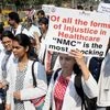 Medical students observe black day during a protest rally against NMC (National Medical Commission) in Bhubaneswar on Tuesday. Photo: PTI