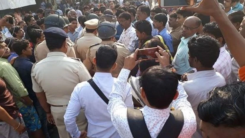Protesters seen gathering at Ghatkopar's Ramabai Colony, police personnel also at the site. Photo: ANI Protesters seen gathering at Ghatkopar's Ramabai Colony, police personnel also at the site. Photo: ANI