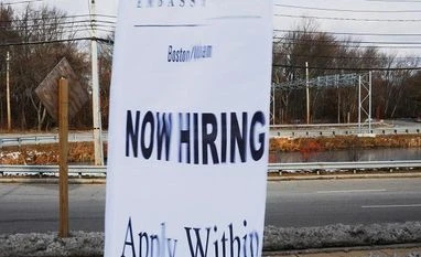 US private jobs growth strongest in 9 months in December at 250,000 A sign advertises open jobs at an Embassy Suites hotel in Waltham, Massachusetts, US. Photo: Reuters