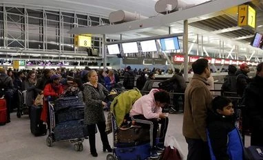 New York airport terminal flooded as brutal cold grips US East Coast New York