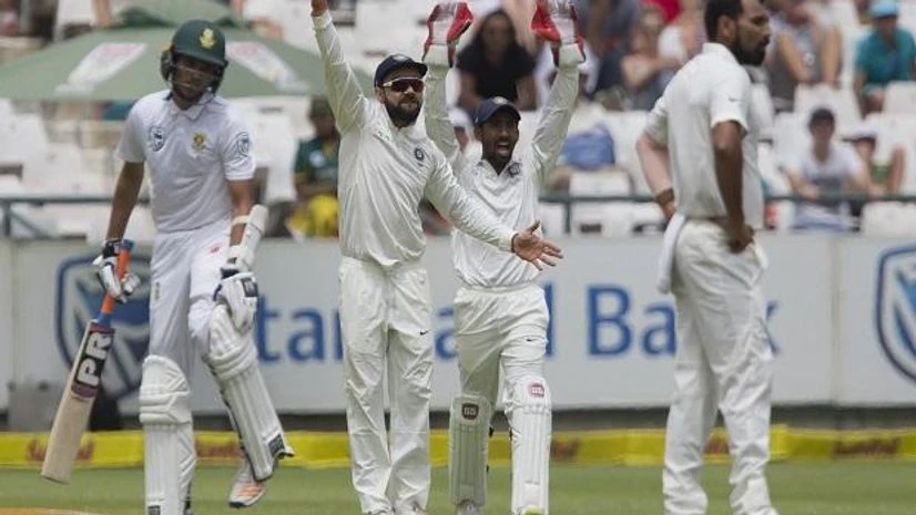 Indian captain Virat Kohli, second left, and Wriddhiman Saha, second right, appeal a wicket on the fourth day of the first test between South Africa and India at Newlands Stadium, in Cape Town, South Africa. Photo: AP/PTI Indian captain Virat Kohli, and Wriddhiman Saha