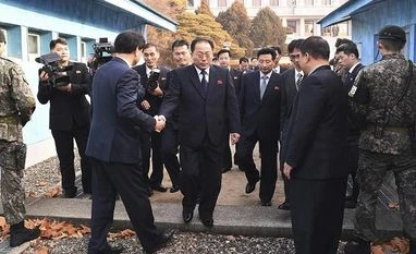 Koreas to form unified ice hockey team, march together in Winter Olympics Paju: In this photo provided by South Korea Unification Ministry, the head of North Korean delegation Jon Jong Su, center, is greeted by a South Korean official as he crosses a border line to attend their meeting at Panmunjom in the Demilitarized Zon