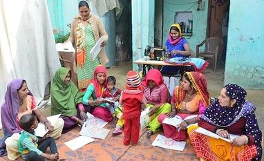 Marora, Haryana Women find time to study together and finish school work Photo: Sanjay K Sharma