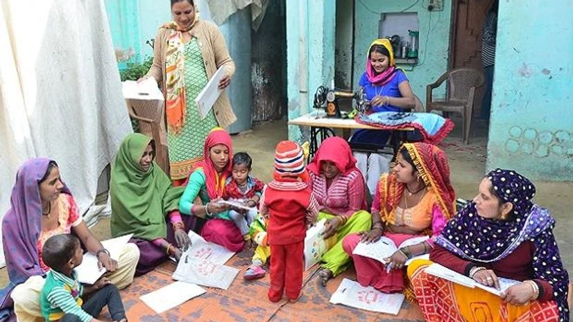 Marora, Haryana Women find time to study together and finish school work Photo: Sanjay K Sharma